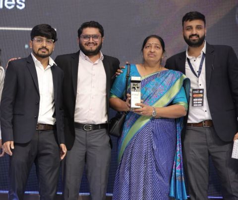 Amenity Technologies team holding the award on stage